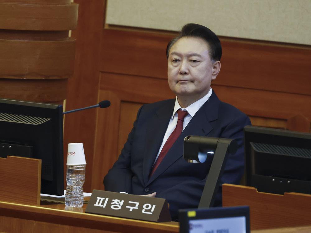 South Korea's impeached President Yoon Suk Yeol attends the fourth hearing of his impeachment trial over his short-lived imposition of martial law at the Constitutional Court in Seoul, South Korea, Thursday, Jan. 23, 2025.