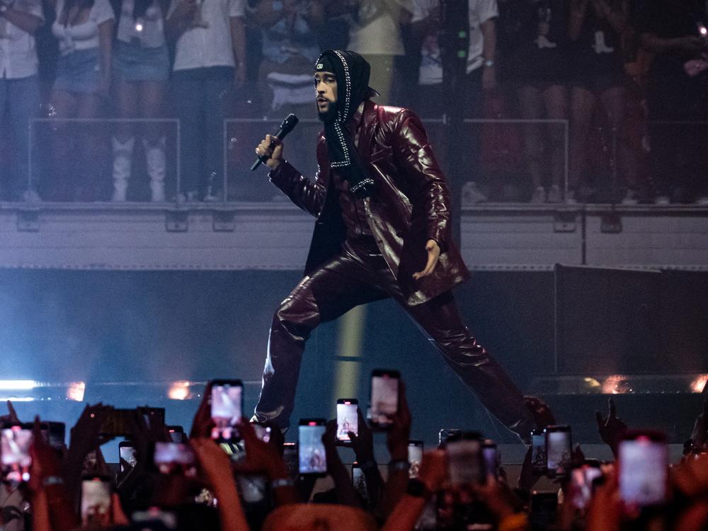 Bad Bunny on stage in Miami in May 2024. The Puerto Rican singer's latest album, <em>Debí Tirar Más Fotos</em>, topped <em>Billboard</em>'s album chart this week.
