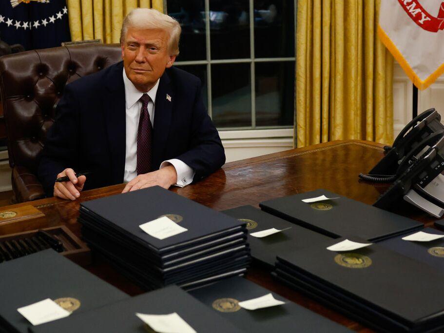 President Donald Trump signs executive orders in the Oval Office on January 20, 2025 in Washington, DC.