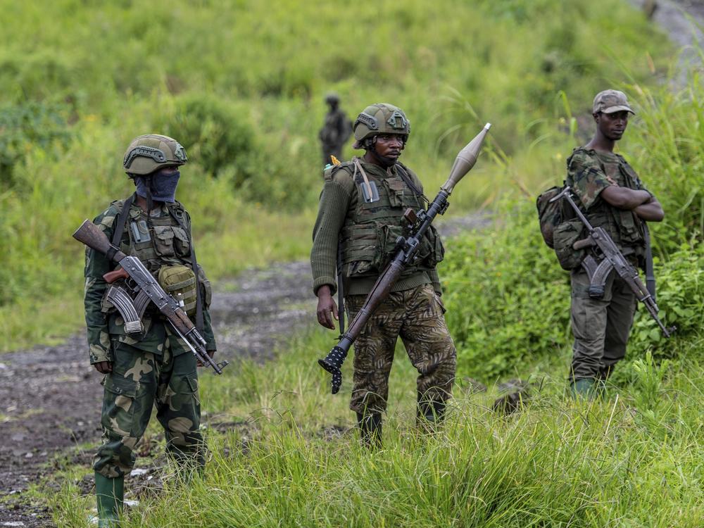 M23 rebels stand with their weapons in Kibumba, in the eastern of Democratic Republic of Congo, Dec. 23, 2022.