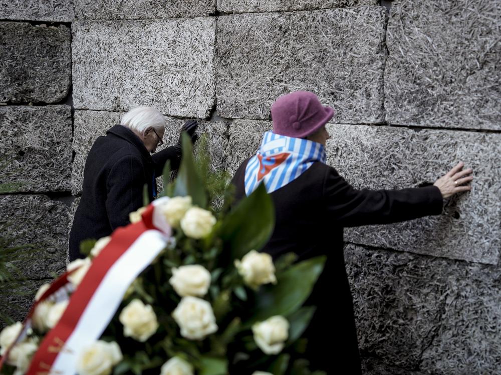 Survivors and relatives attend a ceremony at the Auschwitz-Birkenau former Nazi German concentration and extermination camp, in Oswiecim, Poland, Monday, Jan. 27. 2025.