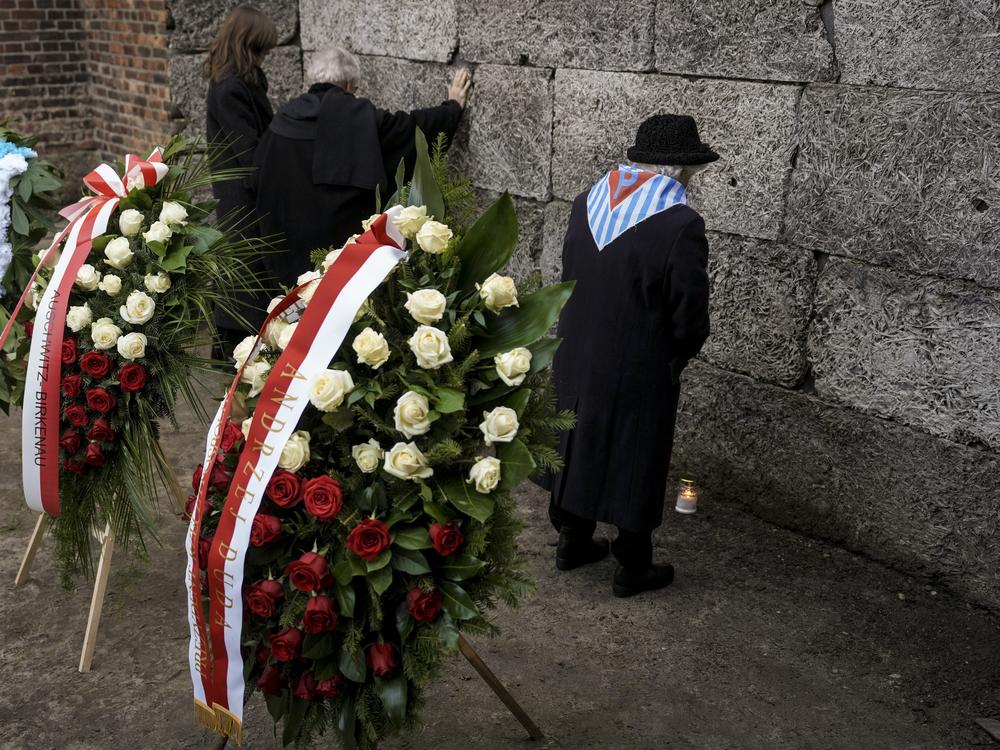 Survivors and relatives attend a ceremony at the Auschwitz-Birkenau former Nazi German concentration and extermination camp, in Oswiecim, Poland, on Monday.