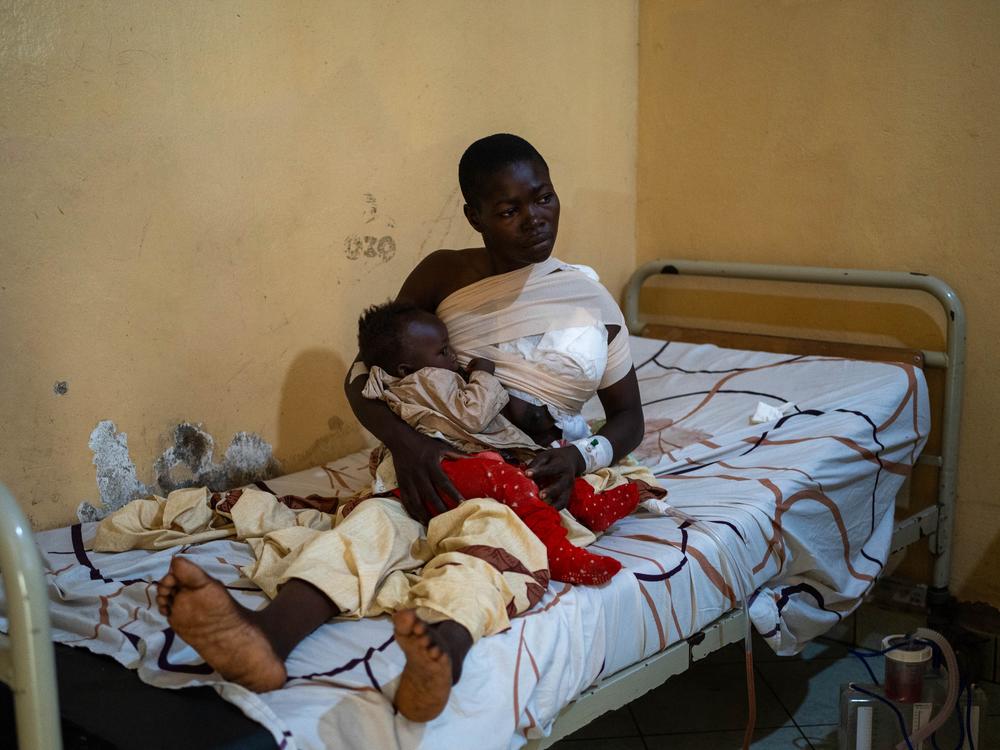 Sifa Kanane, cradles her baby, in Ndosho hospital, Goma, eastern Democratic Republic of Congo.