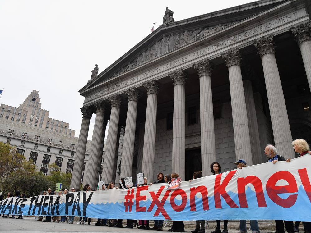 Climate activists protest on the first day of an ExxonMobil trial outside the New York state Supreme Court building in 2019 in New York City.