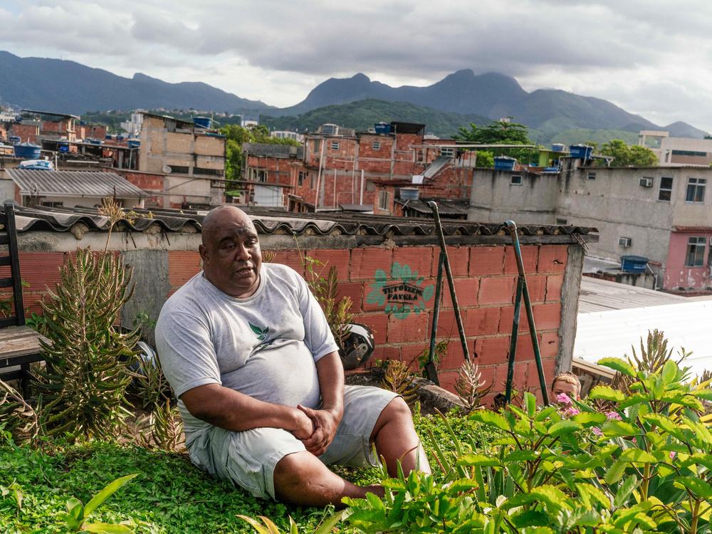 Luis Cassiano is the founder of Teto Verde Favela, a nonprofit that teaches favela residents in Rio de Janeiro, Brazil, how to build their own green roofs as a way to beat the heat. He's photographed at his house, which has a green roof.
