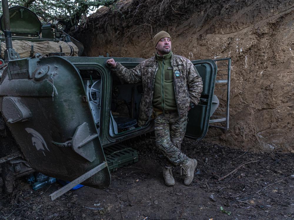 Grizzly stands by a BMP-1, a souped-up Soviet-era infantry fighting vehicle.