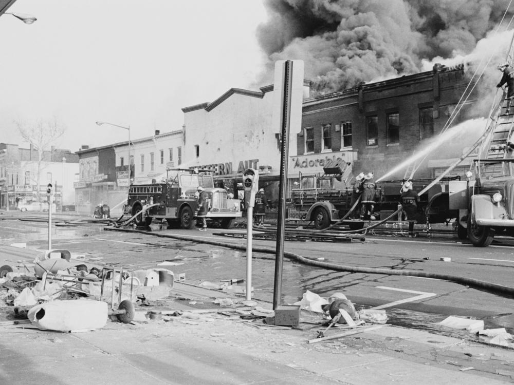 Firefighters tackle a blaze on H Street during the riots in Washington, D.C., that followed the assassination of civil rights activist Martin Luther King Jr., in April 1968.