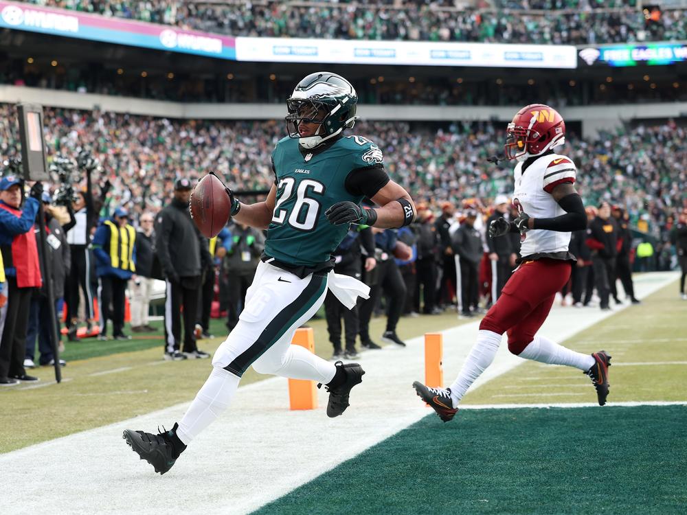 Saquon Barkley of the Philadelphia Eagles scores a 4-yard touchdown against the Washington Commanders during the first quarter in the NFC Championship Game at Lincoln Financial Field on Jan. 25 in Philadelphia, Pennsylvania.