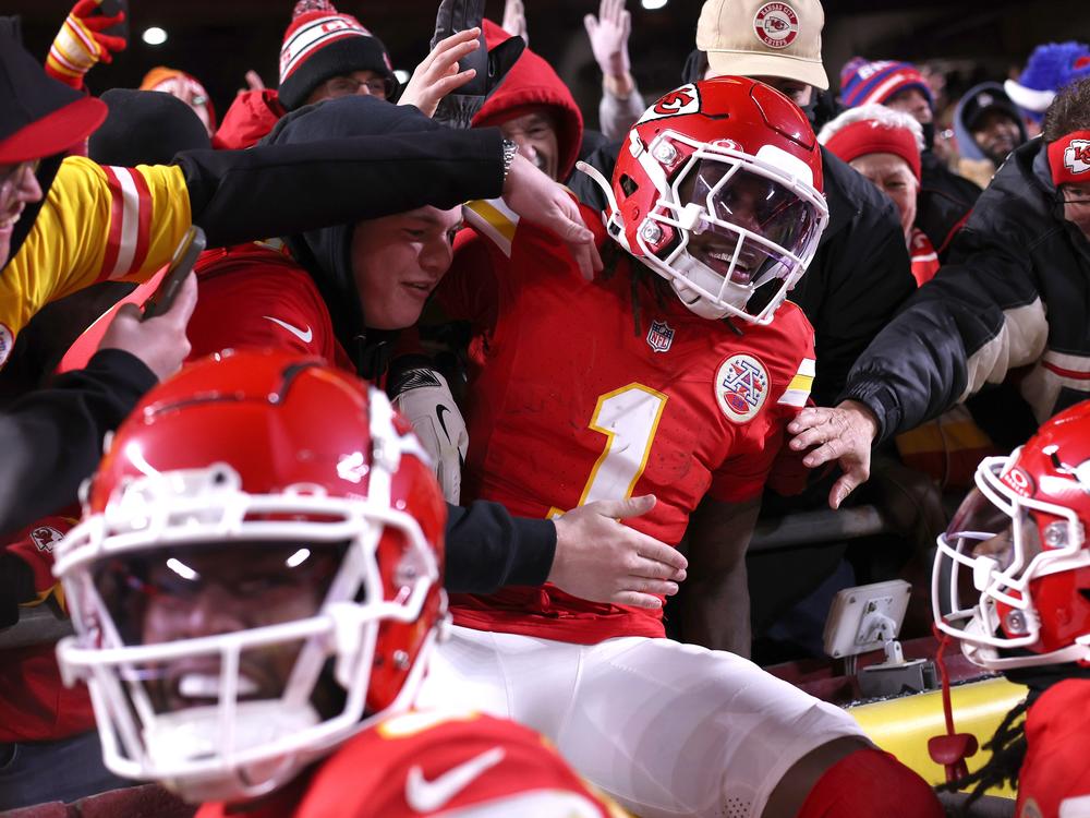 Xavier Worthy #1 of the Kansas City Chiefs jumps into the stands after scoring a touchdown during the second quarter against the Buffalo Bills in the AFC Championship Game at GEHA Field at Arrowhead Stadium on Jan. 26 in Kansas City, Missouri.