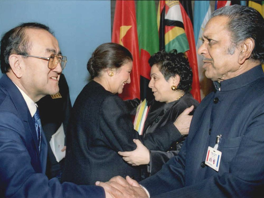 HHS secretary Donna E. Shalala (second from right) greets her French counterpart Simone Weil (second from left) as World  Health Organization director Dr. Hiroshi Nakajima (left) shakes hands with India's health minister Mr. Shankaranand. The photograph is from the AIDS summit at UNESCO headquarters in Paris.
