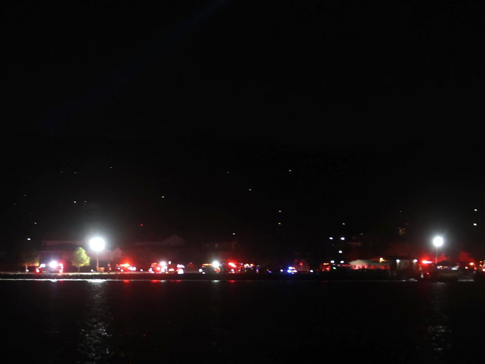 American Airlines Flight 5342 collided in midair with a military helicopter near Ronald Reagan National Airport outside Washington, D.C. Emergency crews work the scene on the shore of the Potomac River near Joint Base Anacostia-Bolling.