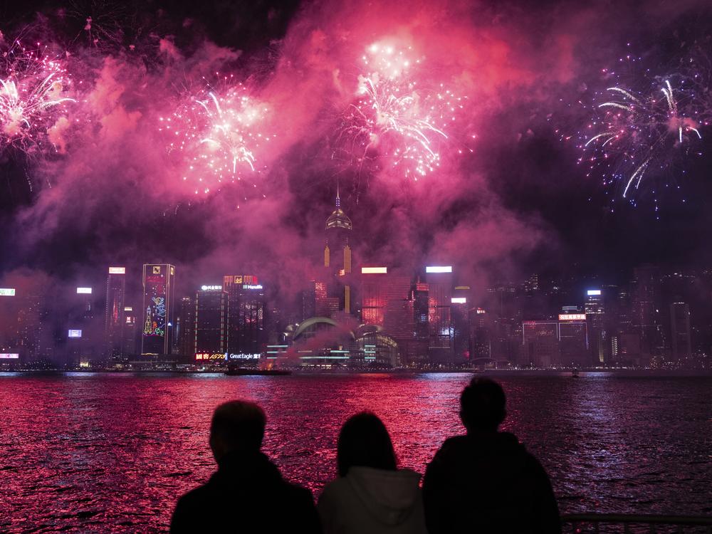 Fireworks light up the sky over Victoria Harbour in Hong Kong on Feb. 11, 2024.