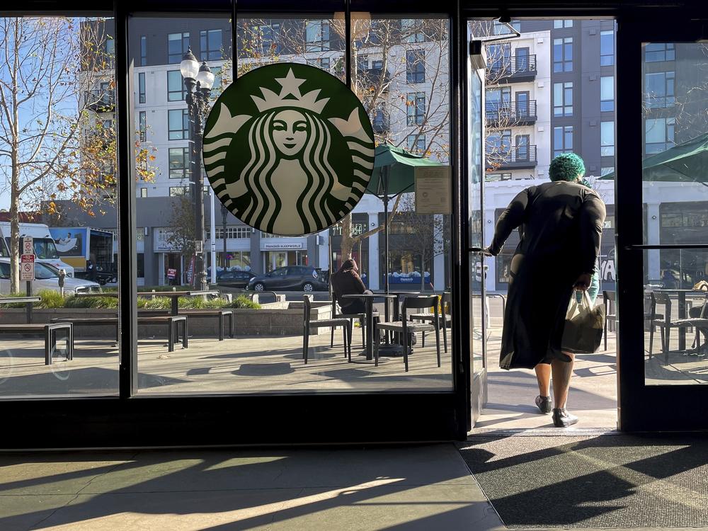 Starbucks is trying to stem the loss of customers by simplifying its menu, reintroducing ceramic mugs and making other changes to be more like a local coffee house.