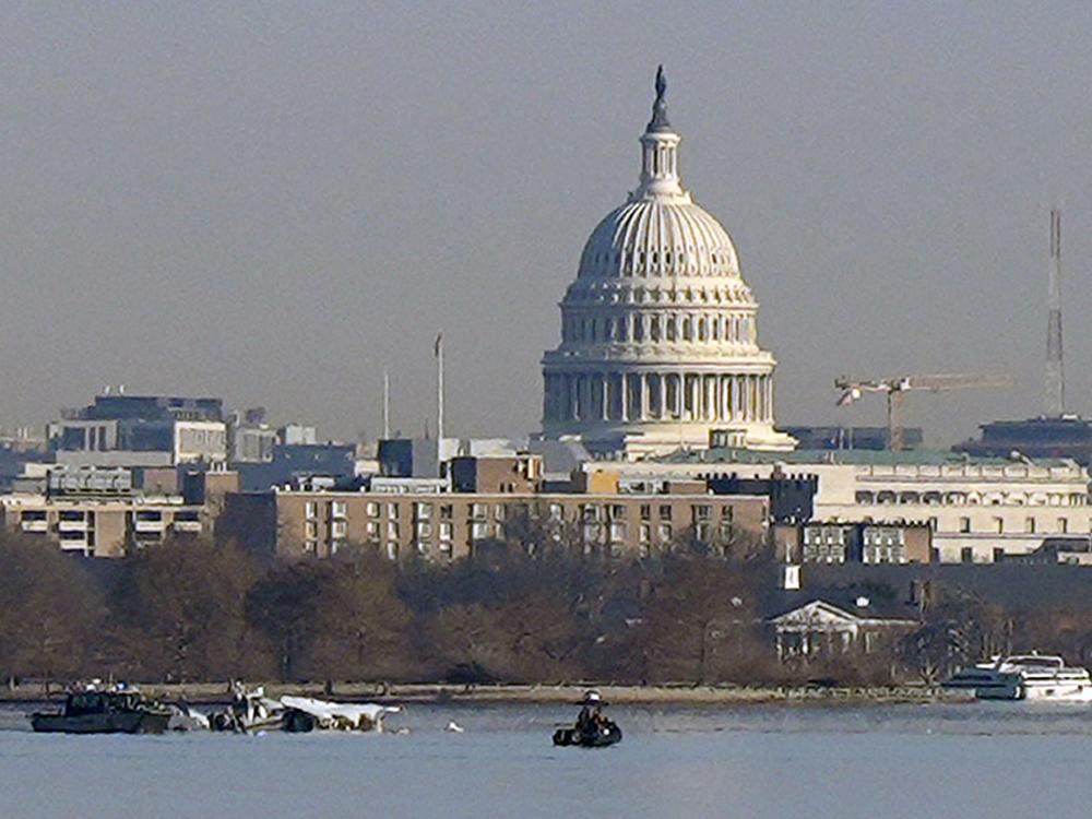 Search and rescue efforts are seen around a wreckage site in the Potomac River from Ronald Reagan Washington National Airport, early Thursday morning, Jan. 30, 2025, in Arlington, Va.