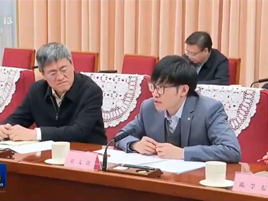 A screenshot of a CCTV broadcast  Liang Wenfeng, right, founder of DeepSeek, at a conference in Beijing on January 20, 2025.