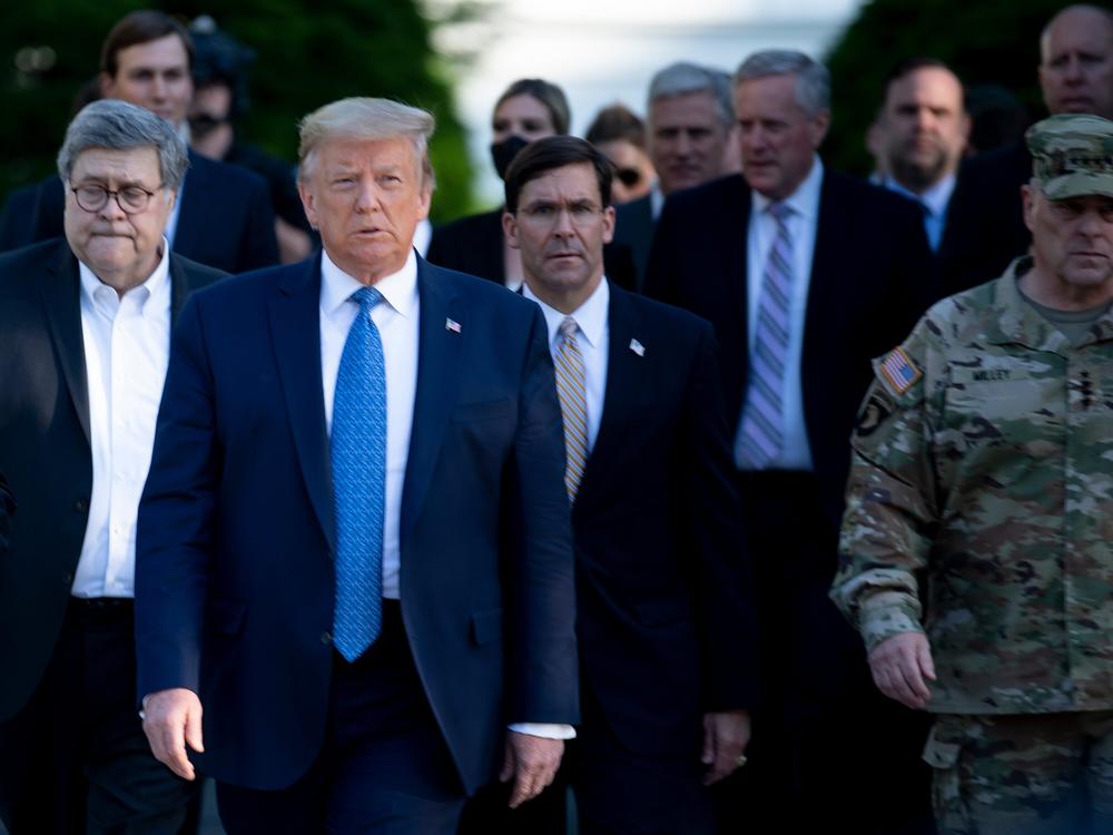 President Trump walks with Attorney General William Barr (left), Secretary of Defense Mark Esper (center), and Chairman of the Joint Chiefs of Staff Mark A. Milley (right), and others from the White House to visit St. John's Church after the area was cleared of people protesting the death of George Floyd on June 1, 2020. Milley later issued an emotional apology at National Defense University, that officials say incensed Trump.