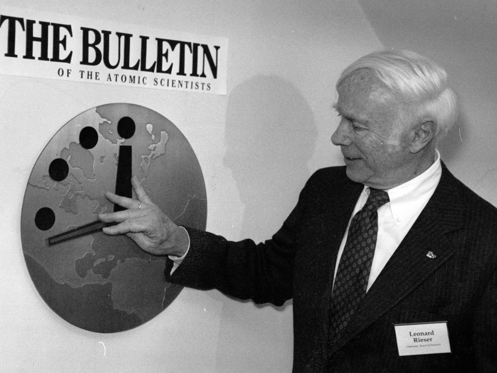 Dr. Leonard Rieser, chairman of the board of the Bulletin of the Atomic Scientists, moves the hand of the Doomsday Clock back to 17 minutes before midnight at offices near the University of Chicago on Nov. 26, 1991.