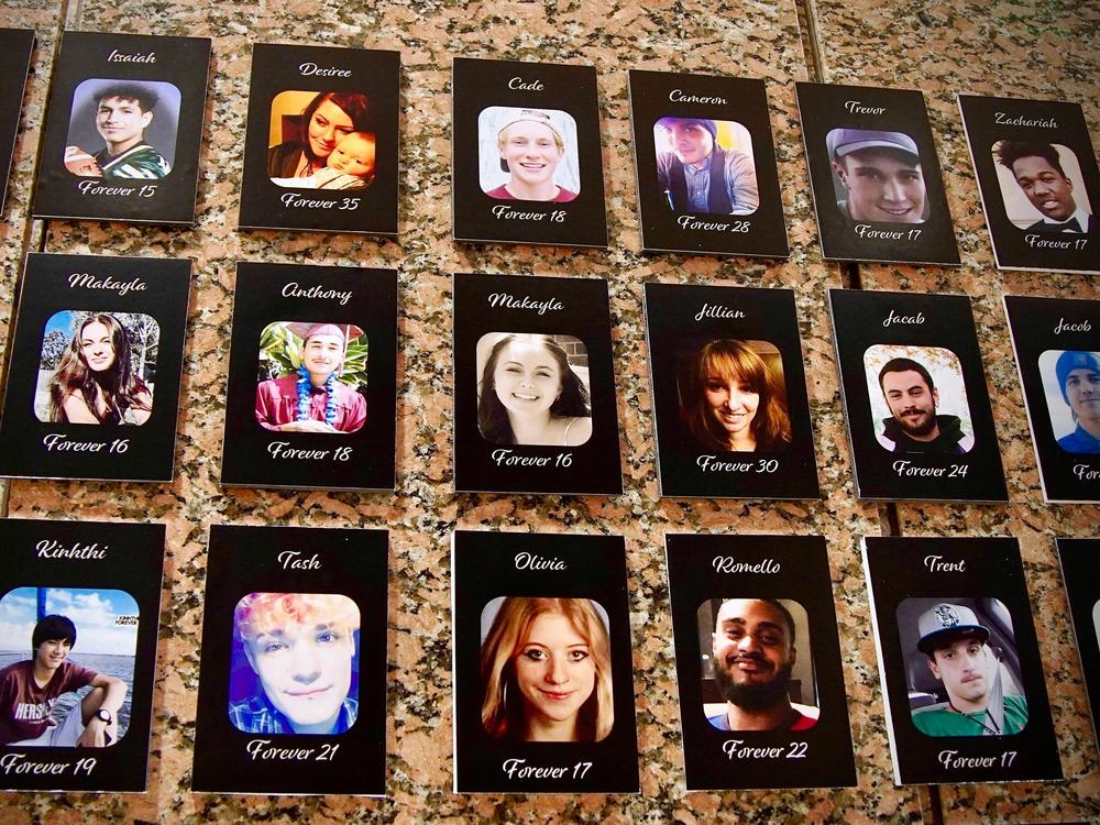 <em>The Faces of Fentanyl</em> wall displays photos of Americans who died from a fentanyl overdose. It's located at the Drug Enforcement Administration's headquarters in Arlington, Virginia.