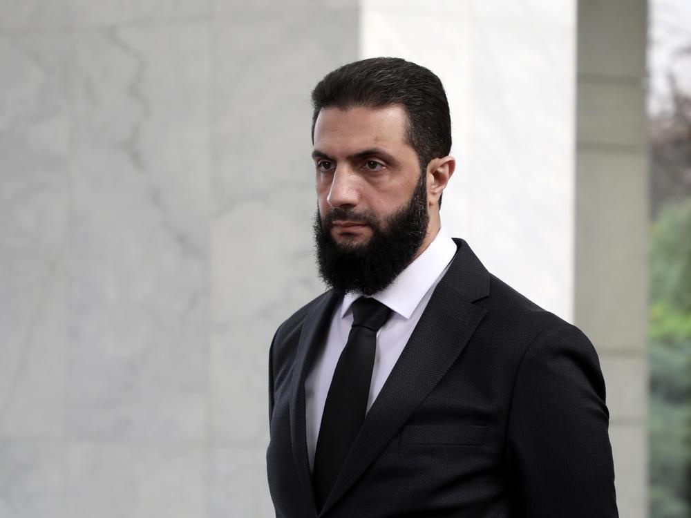 The leader of the new Syrian administration, Ahmed al-Sharaa, waits to meet a Ukrainian delegation on Dec. 30, 2024 in Damascus, Syria.