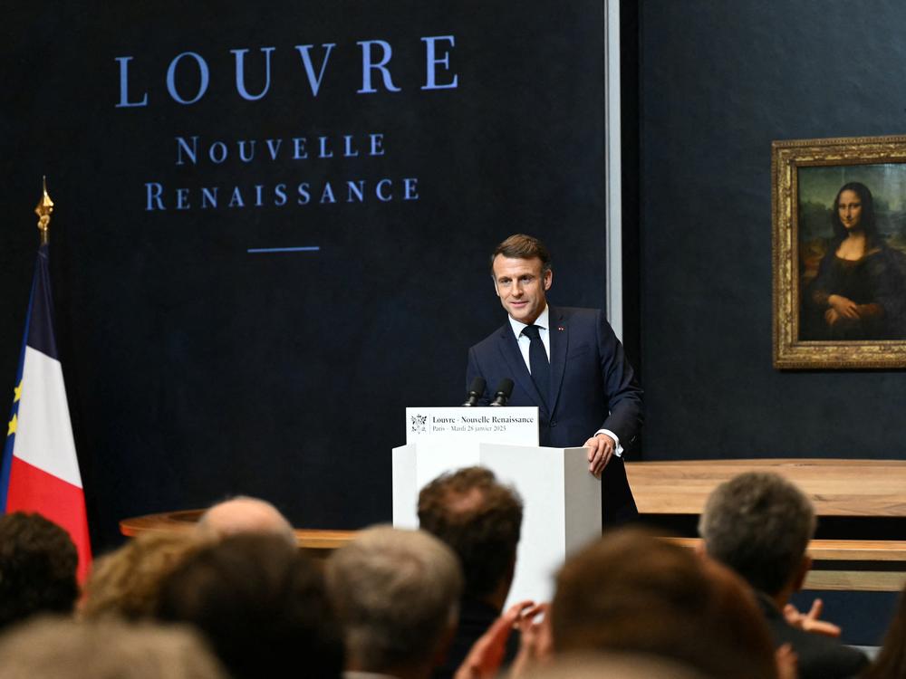 French President Emmanuel Macron gives a speech in front of the <em>Mona Lisa</em> by Leonardo da Vinci at the Louvre in Paris on Tuesday.