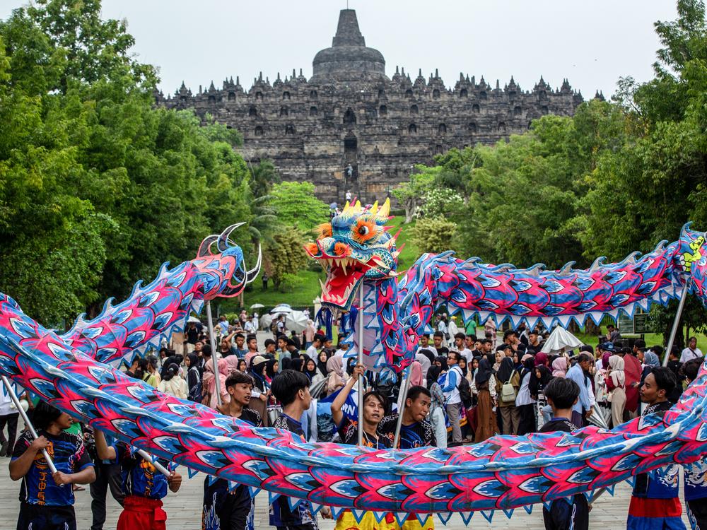 Magelang, Central Java, Indonesia: Performers entertain tourists on the first day of the Lunar New Year of the Snake at Borobudur Temple, a UNESCO World Heritage Site and the largest Buddhist temple in Indonesia, on Jan. 29.