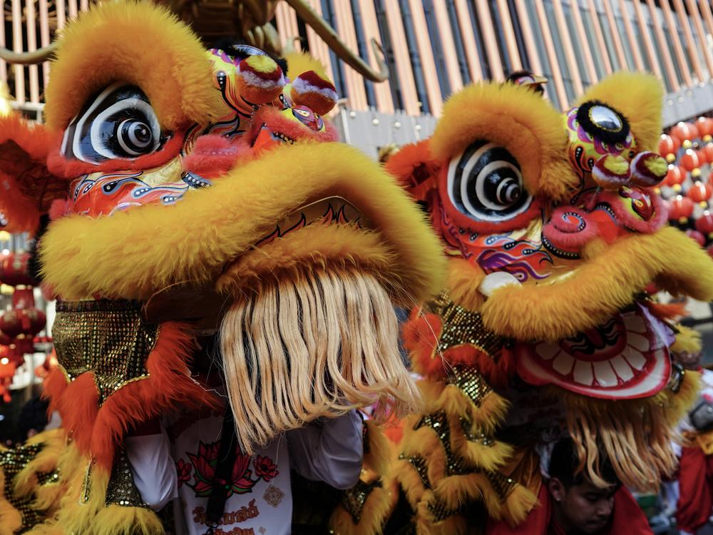 Bangkok, Thailand: Lion Dance performances worship Chinese deities during the Chinese Lunar New Year celebration at a shopping mall in Bangkok, on Jan. 29.