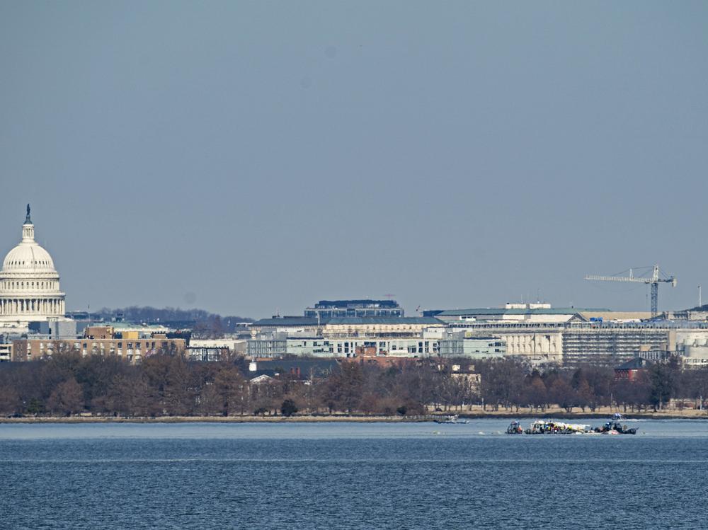 Emergency response units search the crash site of the American Airlines plane on the Potomac River after the plane crashed last night on approach to Reagan National Airport on Thursday in Arlington, Virginia. The American Airlines flight from Wichita, Kansas, collided in midair with a military helicopter while approaching the airport. According to reports, there were no survivors among the 67 people on board both aircraft.