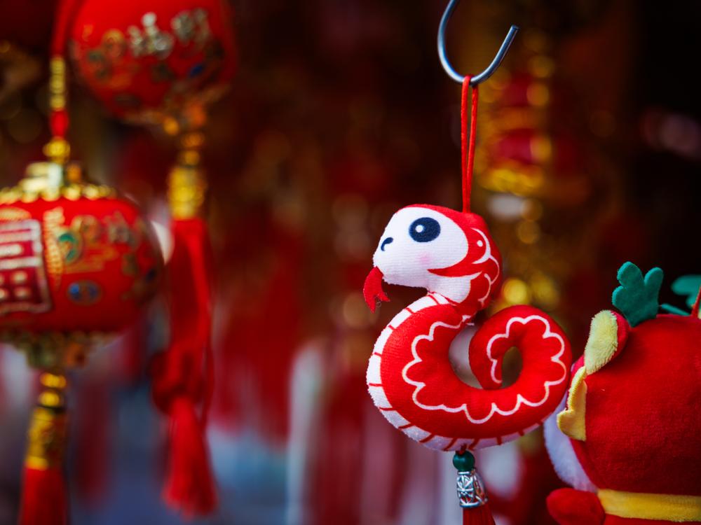 Bangkok, Thailand: A snake plushie hangs from a hook at a street stall on Lunar New Years Eve on Jan. 28.