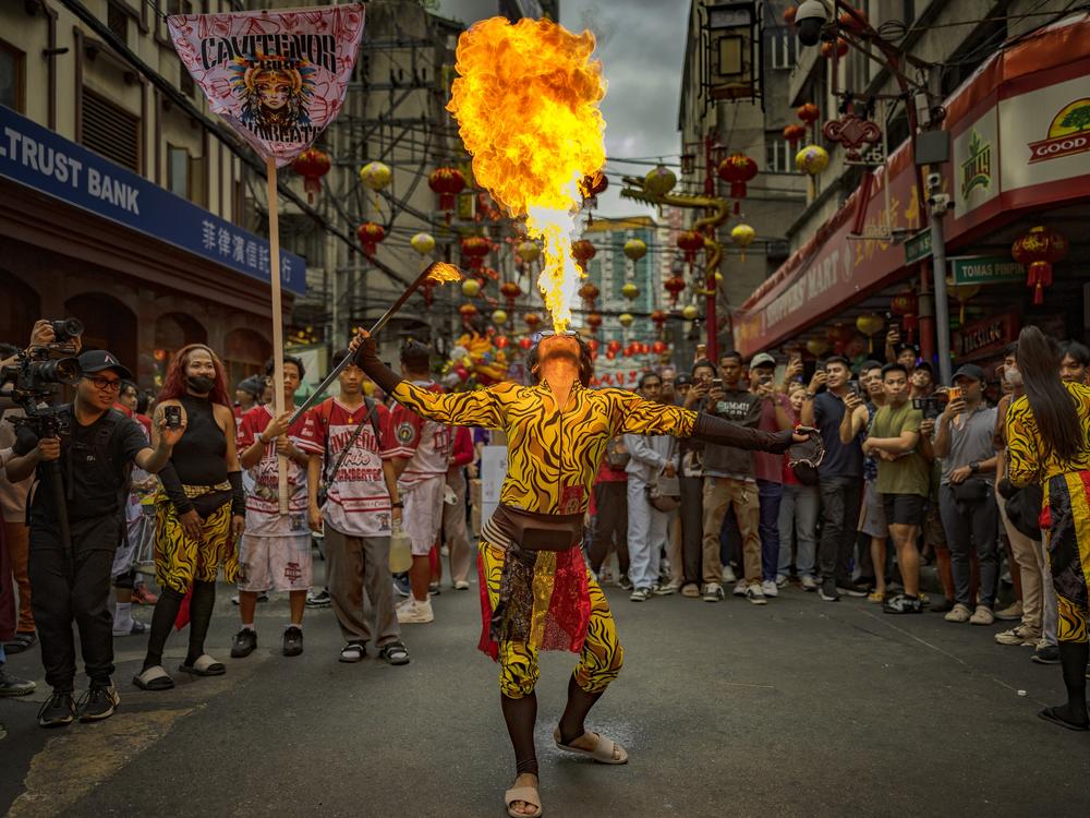 Manila, Philippines: A performer breathes fire during Lunar New Year celebrations at Binondo district, considered the world's oldest Chinatown, on Jan. 29.