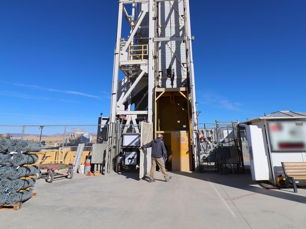 A mining hoist in the middle of a dry lakebed is used to descend to the PULSE underground laboratory.
