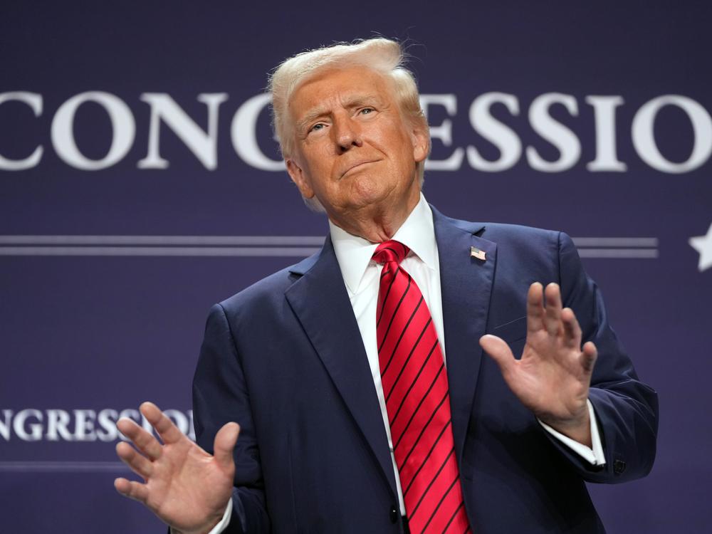President Trump arrives to speak at the House Republican members conference dinner at Trump National Doral Golf Club in Miami on Jan. 27.