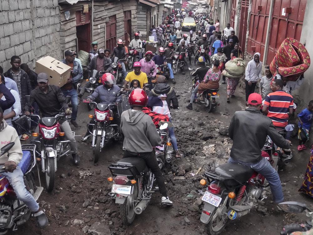 People rush to shop in downtown Goma, Congo, on Thursday, after the M23 rebels advanced into eastern Congo's capital Goma.