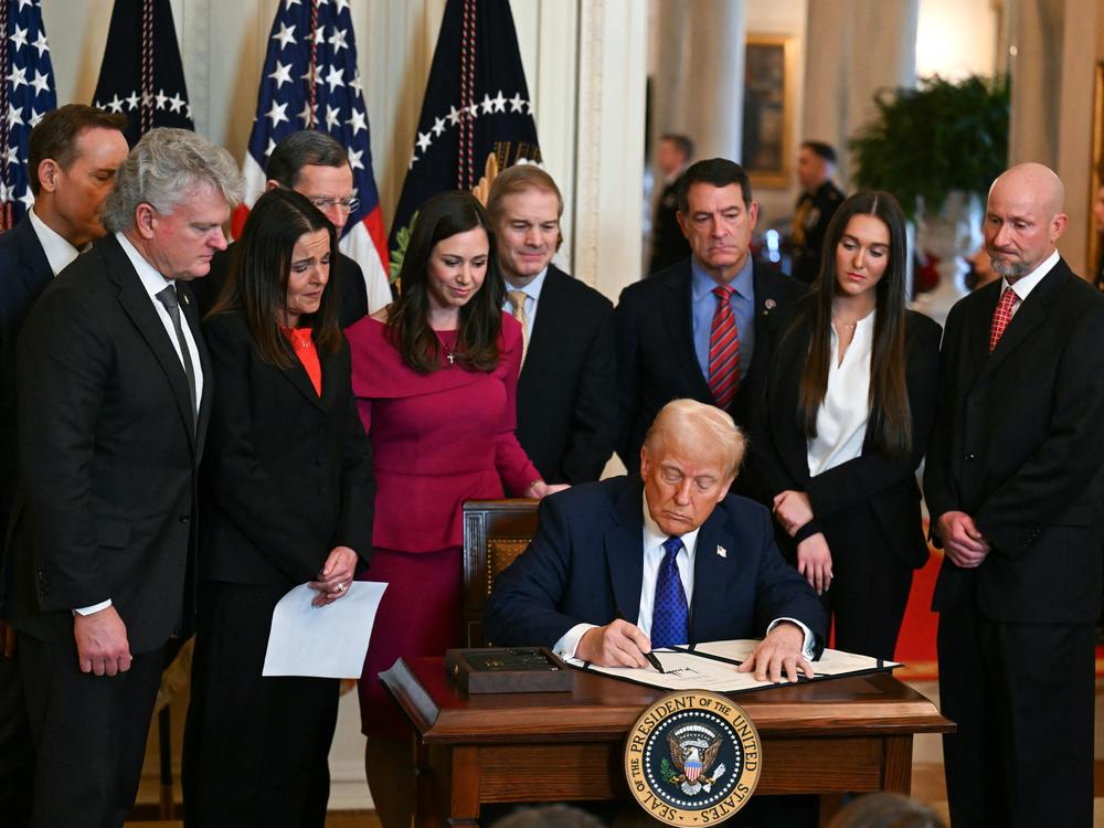 President Trump signs the Laken Riley Act in the East Room of the White House on Jan. 29.
