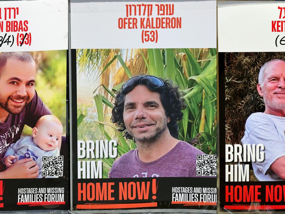 This poster shows three Israeli hostages held in the Gaza Strip since the Oct. 7. 2023: Yarden Bibas (L), Ofer Kalderon and Keith Siegel (R). An Israeli campaign group confirmed the names of three hostages set to be released on February 1, including American and French dual nationals. The Hostage and Missing Families Forum stated that the three captives to be released are Israeli citizen Yarden Bibas, Israeli-American Keith Seigel, and Israeli-French Ofer Kalderon.