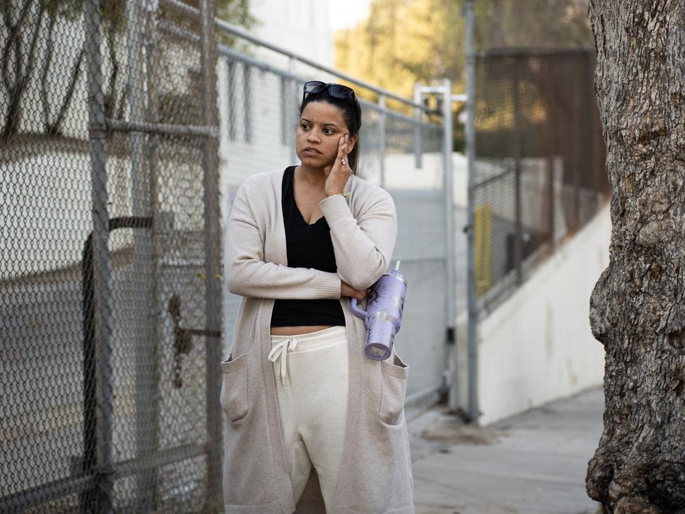 Sandy Roffman stands outside Octavia E. Butler Magnet school, where her daughter Indie attends sixth grade.