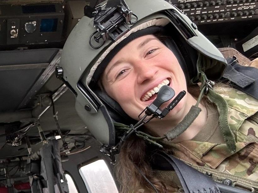 Capt. Rebecca Lobach smiles in the cockpit of a UH-60 Black Hawk helicopter, Feb. 28, 2024. <br>