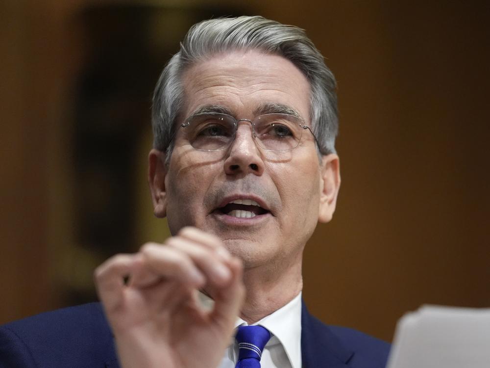 Treasury Secretary Scott Bessent has been tapped by President Trump to be acting director of the Consumer Financial Protection Bureau. Here, he appears before the Senate Finance Committee on Jan. 16.