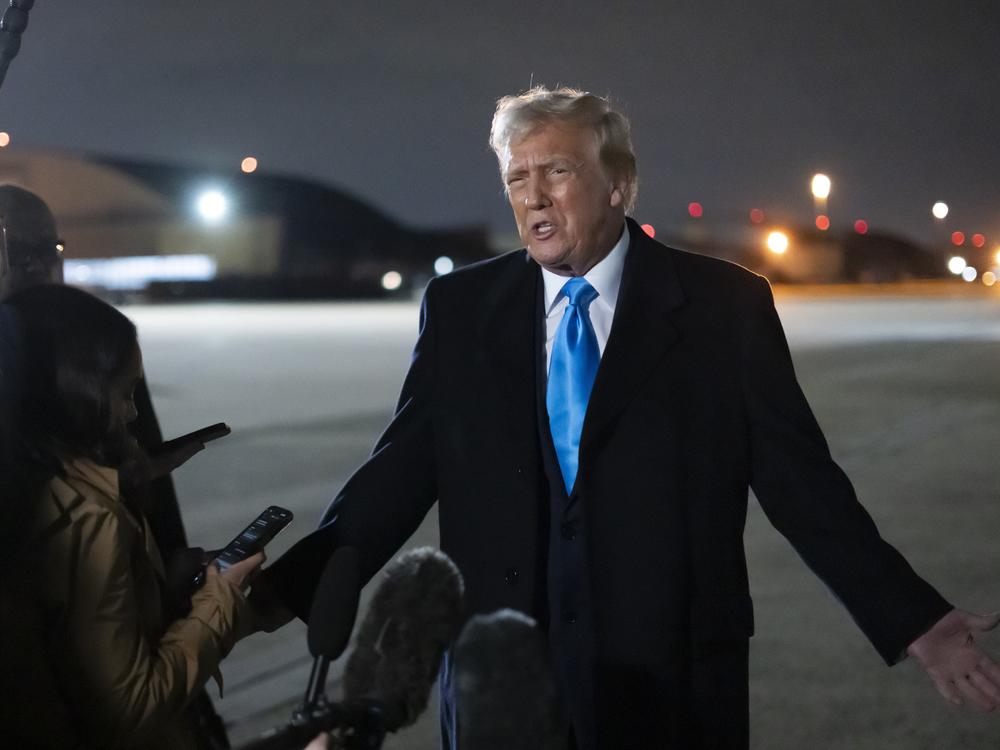 President Trump speaks to reporters next to Air Force One after arriving back at Joint Base Andrews, Md., on Feb. 2.