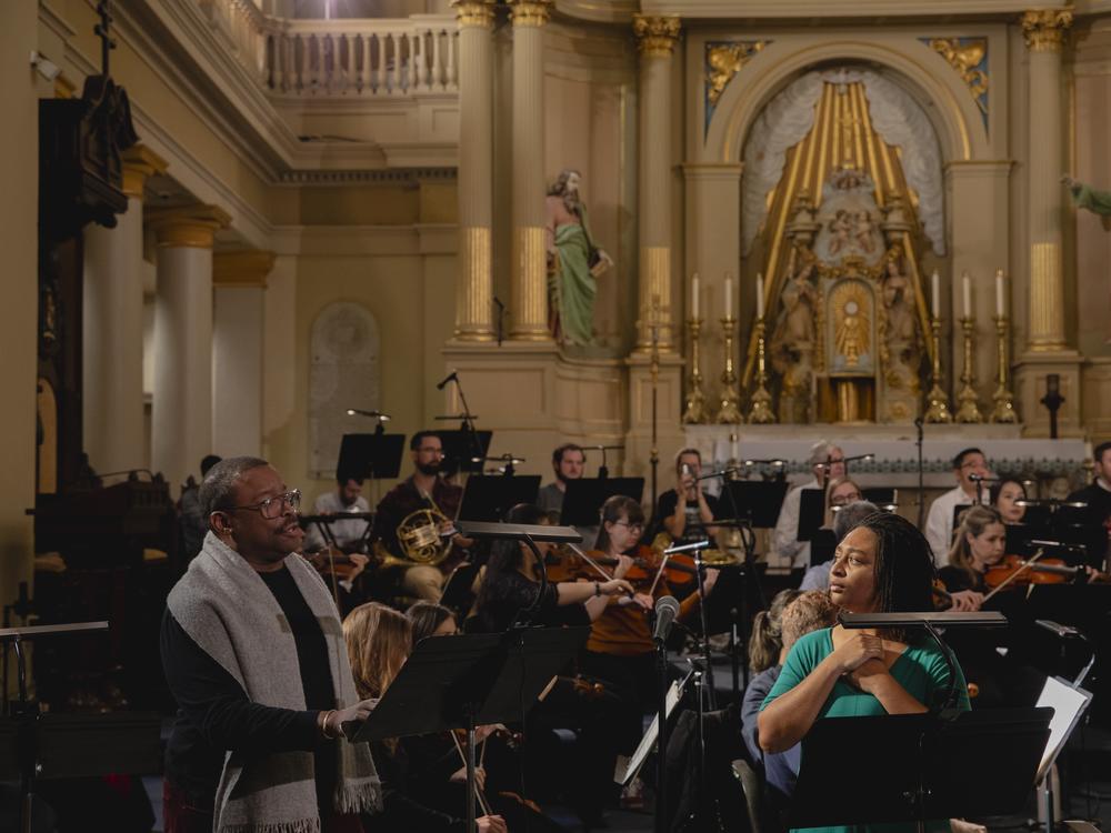 Tenor Chauncey Packer, left, and soprano Taylor J. White, white, rehearse Edmond Dédé's opera <em>Morgiane</em> at St. Louis Cathedral in New Orleans on Jan. 24, 2025, along with members of Opera Lafayette, OperaCréole and the Louisiana Philharmonic Orchestra.