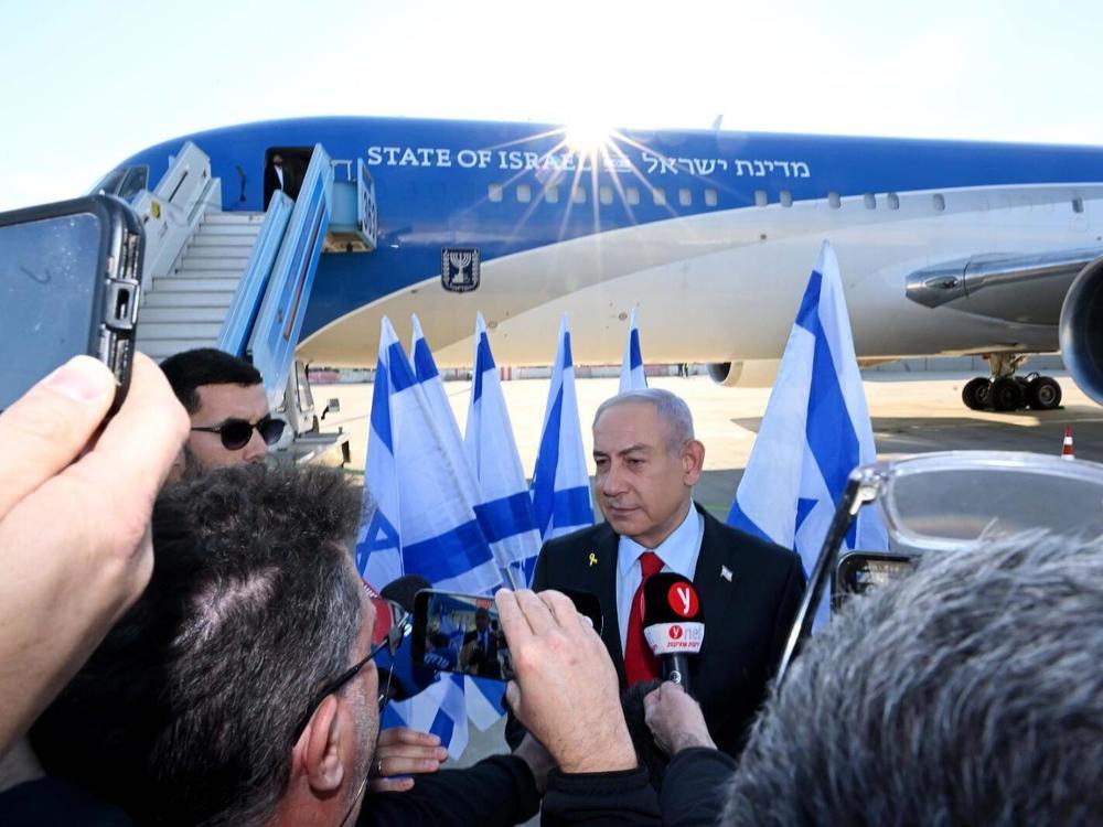 Israeli Prime Minister Benjamin Netanyahu makes statements at Ben Gurion Airport in Tel Aviv, Israel, on Sunday, ahead of his visit to Washington, D.C., where he will meet with President Trump this week.