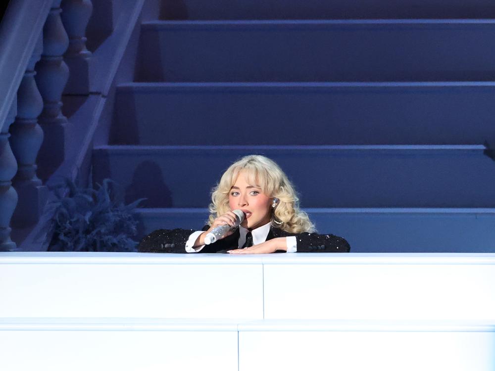 During Sabrina Carpenter's performance at the 67th Grammy Awards, the singer staged several performance mishaps — a shifting spotlight, a hydrolic platform that lowered her behind a set of stairs — as moments of slapstick charm.