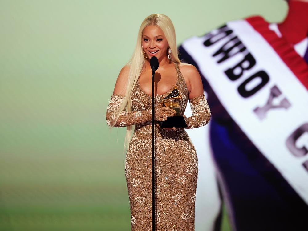 Beyoncé accepts the award for best country album during the 67th Grammy Awards in Los Angeles on February 2, 2025. She won two other awards, including album of the year, for <em>COWBOY CARTER</em>.