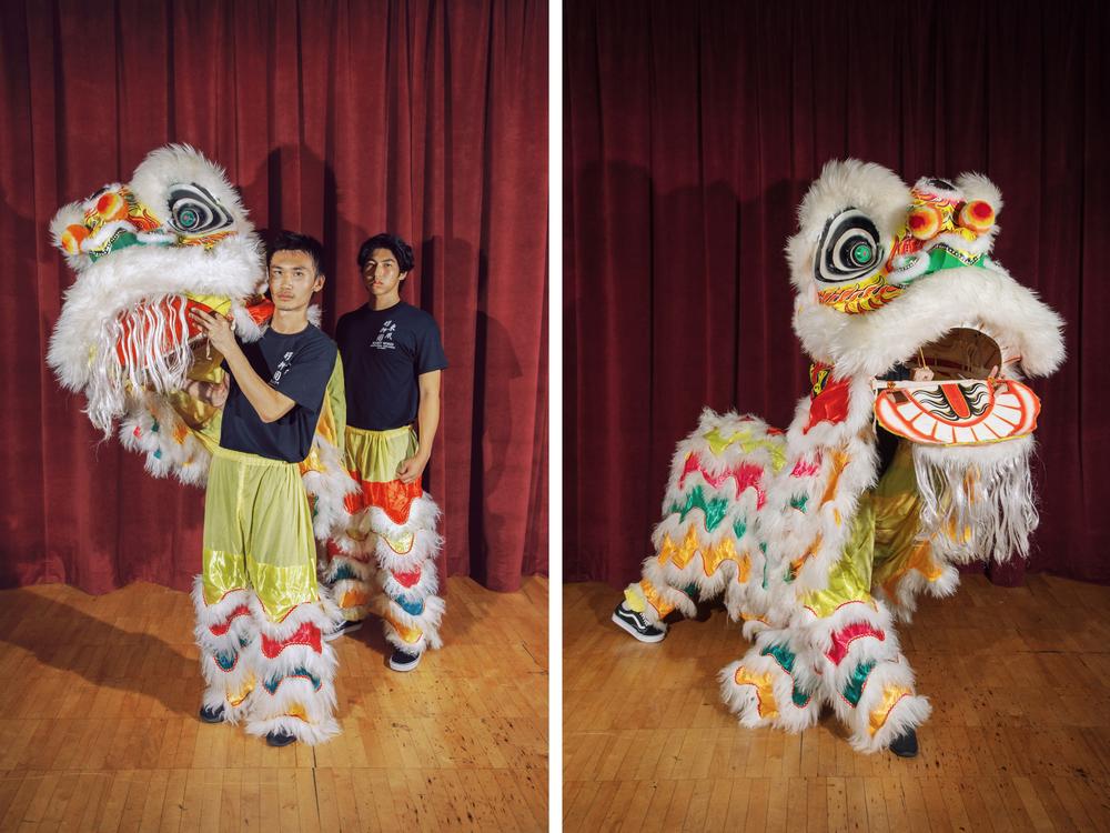 Jayden Vuong and Qida Peng enter the lion at East Wind's headquarters in September 2023.