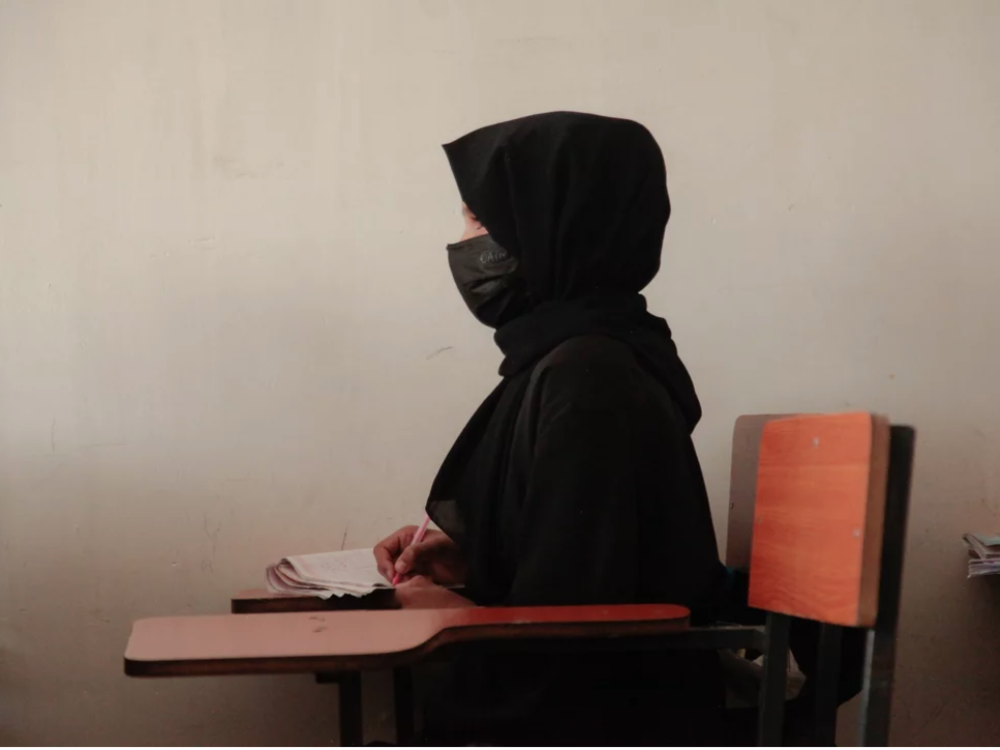 The halt to USAID projects will likely impact secret schools for girls across Afghanistan, which could close as soon as the funds from the U.S. agency go dry. Above: A teenage girl wearing a face mask, head scarf and long black robe at a tutoring center in Kabul, established by a women's rights activist to circumvent a Taliban ban on girls attending secondary school.