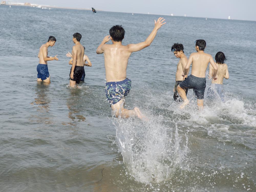 Youths' summer outing on Los Angeles' Cabrillo Beach in July 2023.