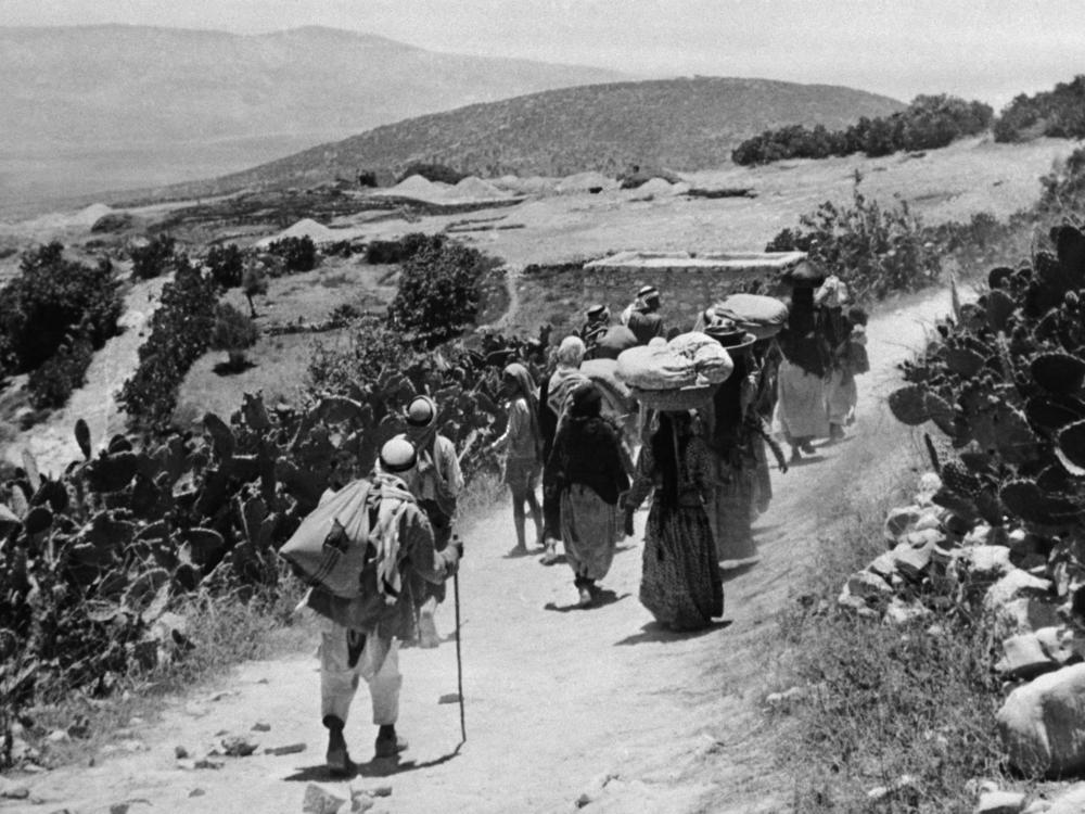 A picture from September 1948 shows Palestinians returning to their village after its surrender during the Arab-Israeli war in 1948, when Israel was established.