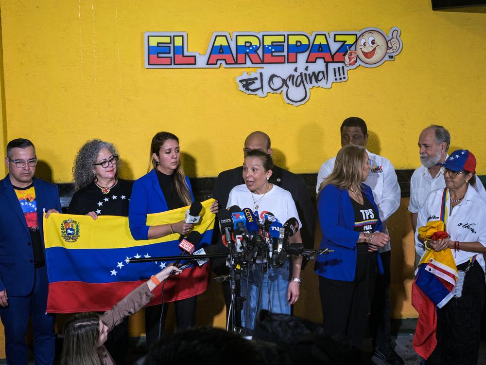 Venezuelan community leaders speak to the media in Doral, Fla., on Monday as they protest against the suspension of temporary protected status. The Trump administration is terminating an immigration program that currently protects hundreds of thousands of Venezuelan migrants in the U.S. from deportation.