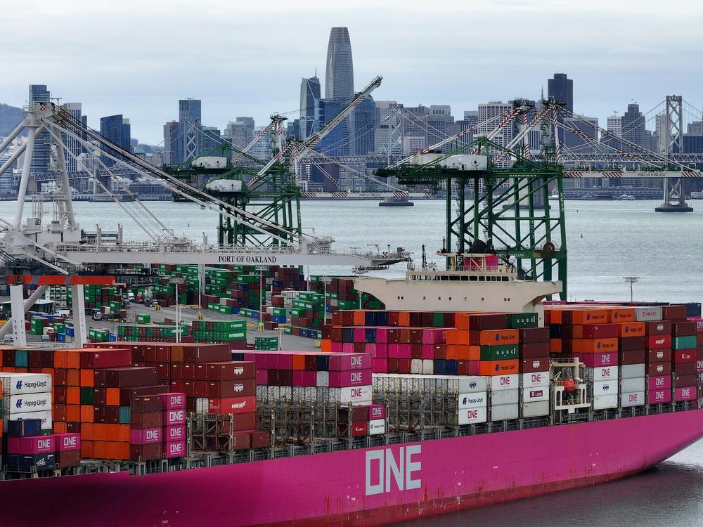 A container ship is docked at the Port of Oakland in California on Monday. Trump has enacted 10% tariffs on goods from China.
