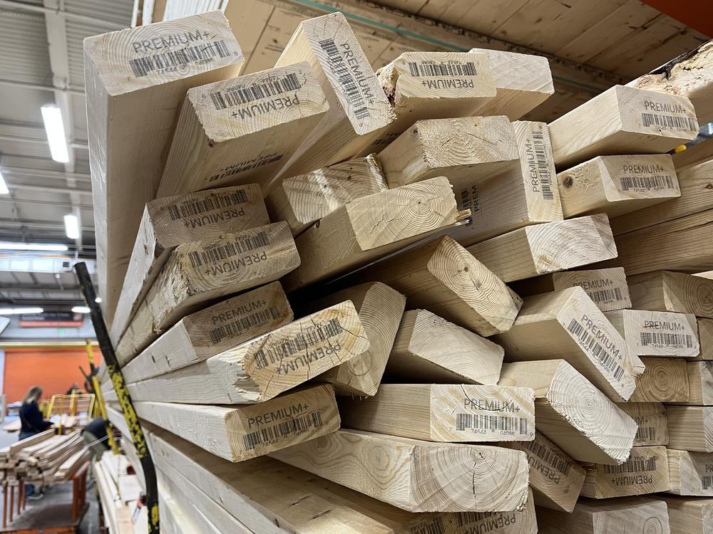Piles of lumber are seen for sale at a home improvement store in Falls Church, Va., on Monday. The U.S. has become somewhat less reliant on Canadian softwood lumber in recent years, but tariffs could still cause building costs to rise.