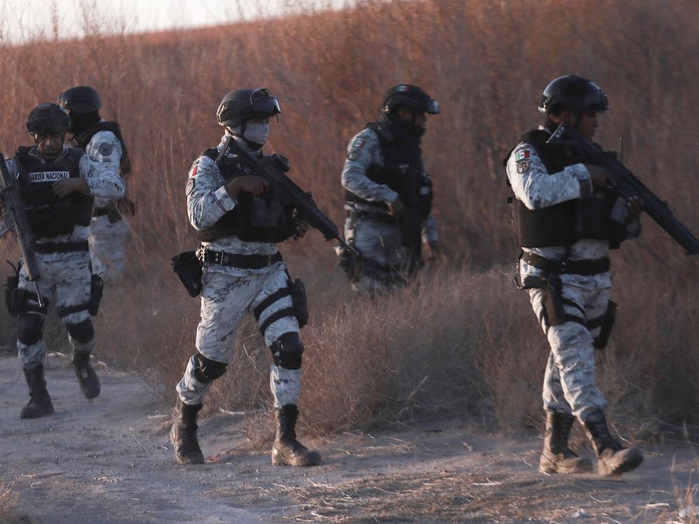 Mexican National Guard members patrol along the Mexico-US border in Ciudad Juarez on Wednesday.